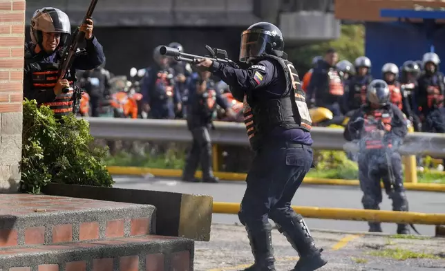 Police aim at protesters demonstrating against the official election results after electoral authorities certified President Nicolas Maduro's reelection in Caracas, Venezuela, Monday, July 29, 2024, the day after the vote. (AP Photo/Fernando Vergara)