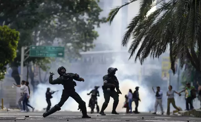 Police hurdle a gas canister at protesters demonstrating against the official election results declaring President Nicolas Maduro's reelection, the day after the vote in Caracas Venezuela, Monday, July 29, 2024. (AP Photo/Matias Delacroix)