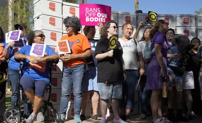 Arizona abortion-rights supporters gather for a news conference prior to delivering over 800,000 petition signatures to the capitol to get abortion rights on the November general election ballot Wednesday, July 3, 2024, in Phoenix. (AP Photo/Ross D. Franklin)