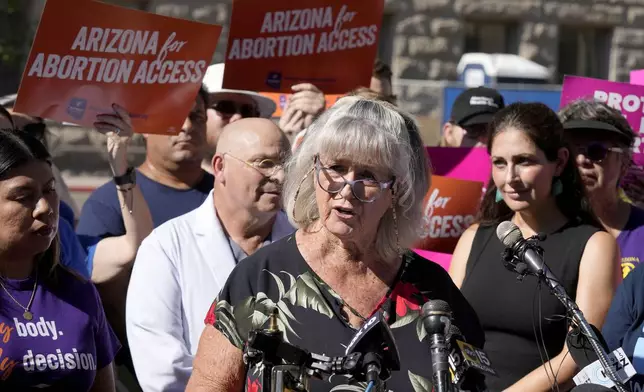 Pamela Hill speaks as she joins Arizona abortion-rights supporters at a news conference prior to delivering over 800,000 petition signatures to the capitol to get abortion rights on the November general election ballot Wednesday, July 3, 2024, in Phoenix. (AP Photo/Ross D. Franklin)