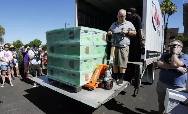 A delivery person rolls a pallet from Arizona abortion-rights supporters delivering over 800,000 petition signatures to the capitol to get abortion rights on the November general election ballot Wednesday, July 3, 2024, in Phoenix. (AP Photo/Ross D. Franklin)