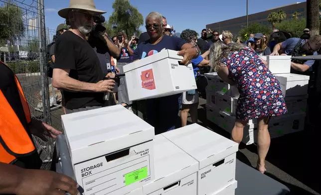 Arizona abortion-rights supporters deliver over 800,000 petition signatures to the capitol to get abortion rights on the November general election ballot Wednesday, July 3, 2024, in Phoenix. (AP Photo/Ross D. Franklin)