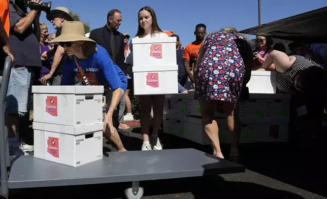 Arizona abortion-rights supporters deliver over 800,000 petition signatures to the capitol to get abortion rights on the November general election ballot Wednesday, July 3, 2024, in Phoenix. (AP Photo/Ross D. Franklin)