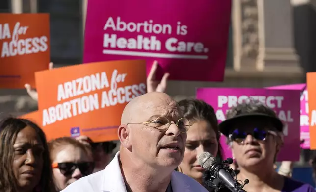 Dr. Paul Isaacson speaks as Arizona abortion-rights supporters gather for a news conference prior to delivering over 800,000 petition signatures to the capitol to get abortion rights on the November general election ballot Wednesday, July 3, 2024, in Phoenix. (AP Photo/Ross D. Franklin)