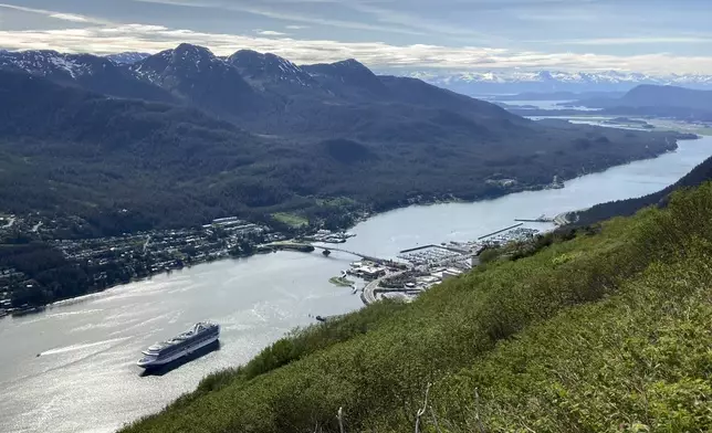 FILE - A cruise ship departs from downtown Juneau, on June 7, 2023, along the Gastineau Channel, in Alaska. Voters in Alaska's capital city could decide in October whether to ban large cruise ships on Saturdays starting next year. (AP Photo/Becky Bohrer, File)