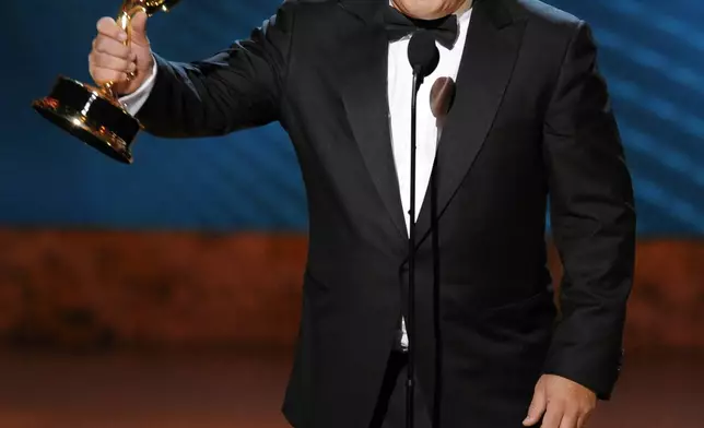 FILE - Alec Baldwin accepts the award for outstanding lead actor in a comedy series for his work on "30 Rock" at the 60th Primetime Emmy Awards Sunday, Sept. 21, 2008, in Los Angeles. Baldwin is going on trial for involuntary manslaughter after nearly 35 years in the public eye. (AP Photo/Mark J. Terrill, File)