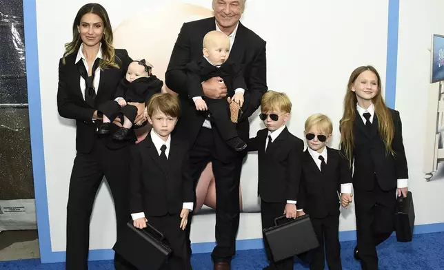 FILE - Actor Alec Baldwin, center, poses with his wife Hilaria Baldwin and their children at the world premiere of "The Boss Baby: Family Business" on June 22, 2021, in New York. Baldwin is going on trial for involuntary manslaughter after nearly 35 years in the public eye. (Photo by Evan Agostini/Invision/AP, File)