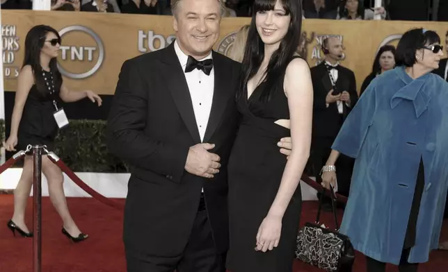 FILE - Actor Alec Baldwin, left, and his daughter Ireland Baldwin arrive at the 15th Annual Screen Actors Guild Awards on Sunday, Jan. 25, 2009, in Los Angeles. Baldwin is going on trial for involuntary manslaughter after nearly 35 years in the public eye. The actor began his career in soap operas before moving on to movies in 1988. (AP Photo/Chris Pizzello, File)