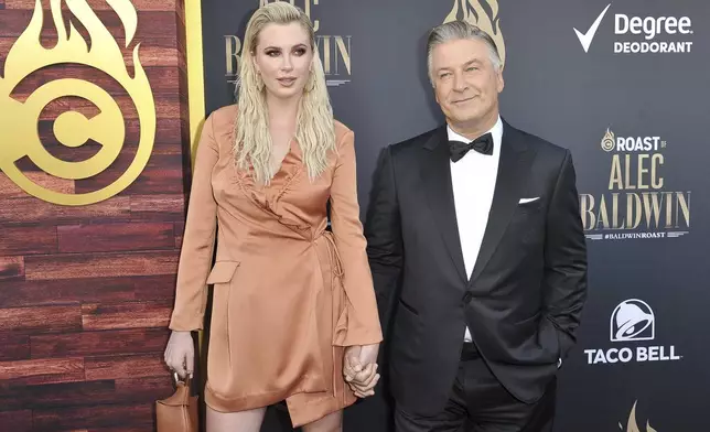 FILE - Ireland Baldwin, left, and Alec Baldwin attend the Comedy Central roast of Alec Baldwin at the Saban Theatre on Saturday, Sept. 7, 2019, in Beverly Hills, Calif. Baldwin is going on trial for involuntary manslaughter after nearly 35 years in the public eye. (Photo by Richard Shotwell/Invision/AP, File)