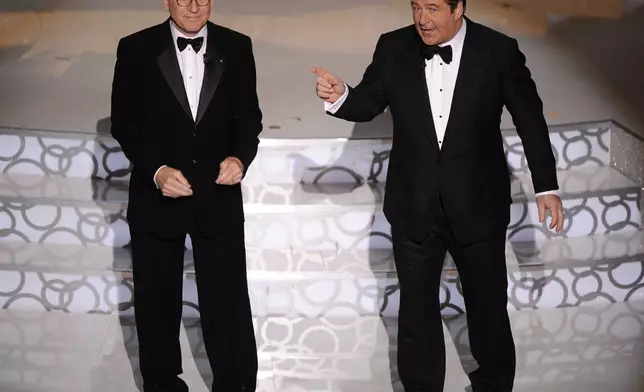 FILE - Steve Martin and Alec Baldwin appear during the 82nd Academy Awards Sunday, March 7, 2010, in the Hollywood section of Los Angeles. Baldwin is going on trial for involuntary manslaughter after nearly 35 years in the public eye. (AP Photo/Mark J. Terrill, File)