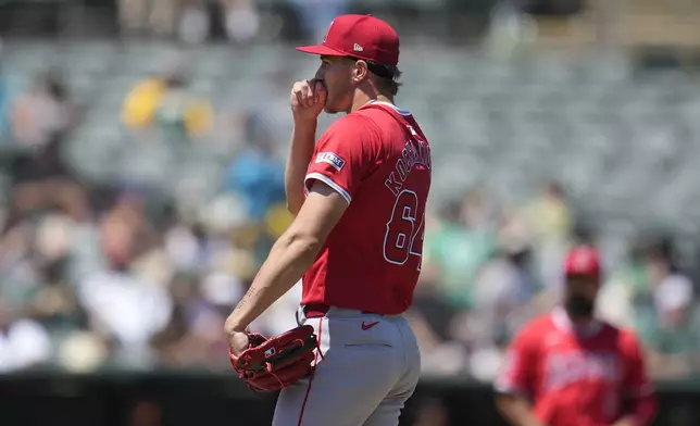 Los Angeles Angels pitcher Jack Kochanowicz reacts after walking Oakland Athletics' Max Schuemann with the bases loaded during the fourth inning of a baseball game in Oakland, Calif., Saturday, July 20, 2024. (AP Photo/Jeff Chiu)