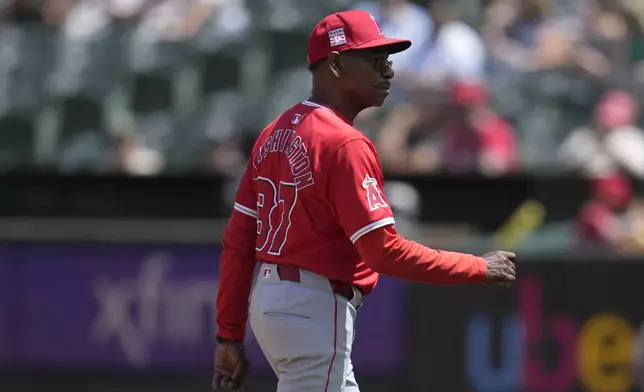 Los Angeles Angels manager Ron Washington walks to the dugout after making a pitching change during the fifth inning of a baseball game against the Oakland Athletics in Oakland, Calif., Sunday, July 21, 2024. (AP Photo/Jeff Chiu)