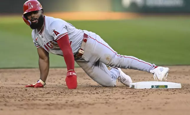 Los Angeles Angels third base Luis Rengifo (2) steals second base against the Oakland Athletics during the fifth inning of a baseball game Tuesday, July 2, 2024, in Oakland, Calif. (AP Photo/Eakin Howard)