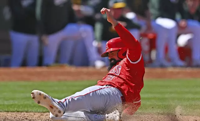 Los Angeles Angels' Anthony Rendon scores on two-run double by teammate Kevin Pillar during the eighth inning of a baseball game against the Oakland Athletics in Oakland, Calif., Sunday, July 21, 2024. (Jose Carlos Fajardo/Bay Area News Group via AP)