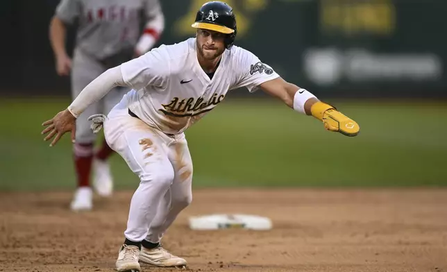 Oakland Athletics shortstop Max Schuemann (12) runs to third base against the Los Angeles Angels during the fifth inning of a baseball game Tuesday, July 2, 2024, in Oakland, Calif. (AP Photo/Eakin Howard)