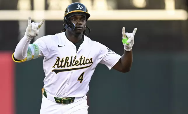 Oakland Athletics outfielder Lawrence Butler (4) runs the bases after hitting a three-run home run against the Los Angeles Angels during the fourth inning of a baseball game Tuesday, July 2, 2024, in Oakland, Calif. (AP Photo/Eakin Howard)