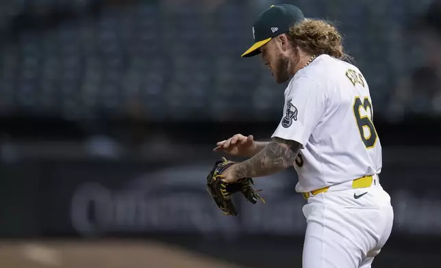 Oakland Athletics pitcher Joey Estes reacts after second baseman Zack Gelof turned a double play against the Los Angeles Angels during the eighth inning of a baseball game, Wednesday, July 3, 2024, in Oakland, Calif. (AP Photo/Godofredo A. Vásquez)