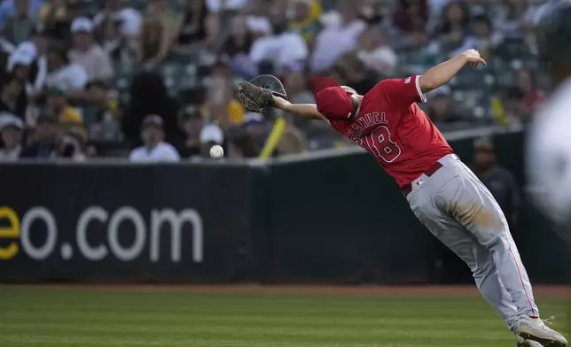 Los Angeles Angels first baseman Nolan Schanuel is unable to catch a ball hit into foul territory by Oakland Athletics' Zack Gelof during the seventh inning of a baseball game Wednesday, July 3, 2024, in Oakland, Calif. (AP Photo/Godofredo A. Vásquez)
