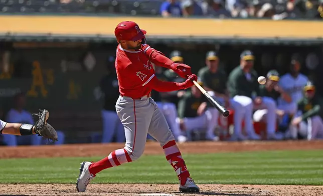 Los Angeles Angels' Kevin Pillar connects for a two-run double against the Oakland Athletics during the eighth inning of a baseball game in Oakland, Calif., Sunday, July 21, 2024. (Jose Carlos Fajardo/Bay Area News Group via AP)