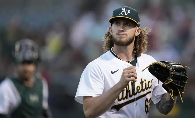 Oakland Athletics' Joey Estes walks to the dugout after pitching against the Los Angeles Angels during the seventh inning of a baseball game Wednesday, July 3, 2024, in Oakland, Calif. (AP Photo/Godofredo A. Vásquez)