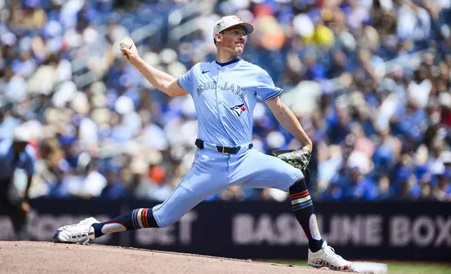 Toronto Blue Jays pitcher Chris Bassitt throws the ball during the first inning of a baseball game against the Houston Astros, in Toronto on Thursday, July 4, 2024. (Christopher Katsarov/The Canadian Press via AP)