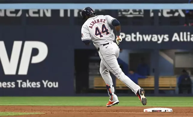 Houston Astros' Yordan Alvarez (44) rounds the bases after hitting a solo home run against the Toronto Blue Jays during the sixth inning of a baseball game in Toronto on Wednesday, July 3, 2024. (Jon Blacker/The Canadian Press via AP)