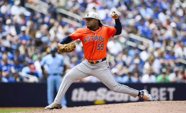 Houston Astros pitcher Framber Valdez (59) throws during the second inning of a baseball game against the Toronto Blue Jays in Toronto on Thursday, July 4, 2024. (Christopher Katsarov/The Canadian Press via AP)