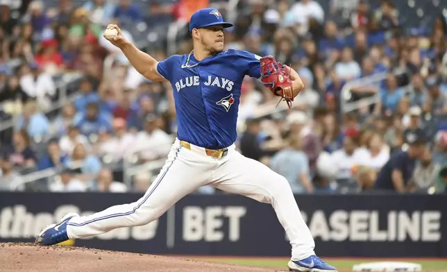 Toronto Blue Jays pitcher Jose Berrios (17) works against the Houston Astros during the first inning of a baseball game, Tuesday, July 2, 2024, in Toronto. (Jon Blacker/The Canadian Press via AP)