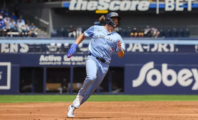 Toronto Blue Jays' Spencer Horwitz runs to third base during the first inning of a baseball game against the Houston Astros in Toronto on Thursday, July 4, 2024. (Christopher Katsarov/The Canadian Press via AP)
