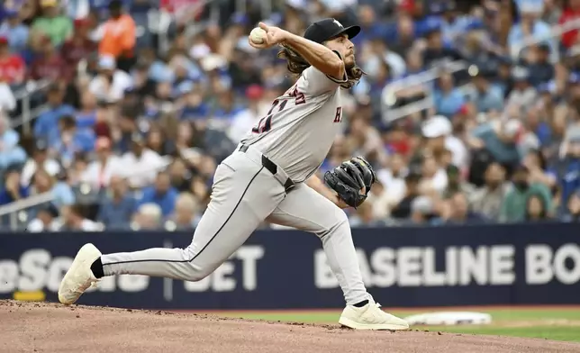 Houston Astros pitcher Spencer Arrighetti (41) works against the Toronto Blue Jays during the first inning of a baseball game, Tuesday, July 2, 2024, in Toronto. (Jon Blacker/The Canadian Press via AP)