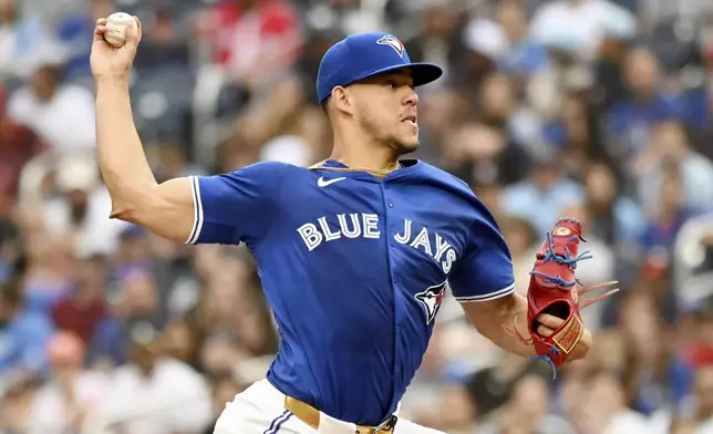 Toronto Blue Jays pitcher Jose Berrios (17) works against the Houston Astros during the first inning of a baseball game, Tuesday, July 2, 2024, in Toronto. (Jon Blacker/The Canadian Press via AP)