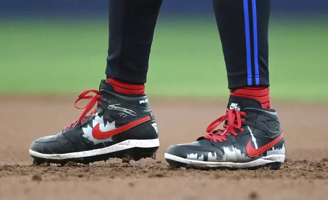 Toronto Blue Jays first baseman Vladimir Guerrero Jr. (27) wears City Connect spikes against the Houston Astros during the third inning of a baseball game in Toronto on Wednesday, July 3, 2024. (Jon Blacker/The Canadian Press via AP)