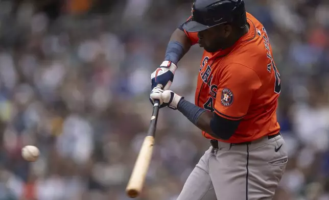 Houston Astros' Yordan Alvarez hits a single during the first inning of a game against the Seattle Mariners, Sunday, July 21, 2024, in Seattle. (AP Photo/Stephen Brashear)