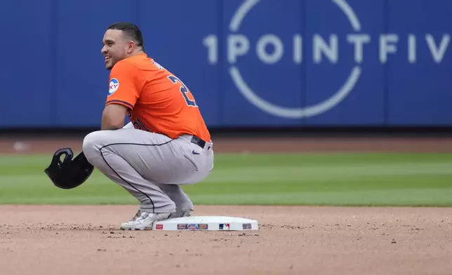Houston Astros' Yainer Diaz looks on from second base as teammate Jon Singleton bats during the fourth inning of a baseball game against the New York Mets, Sunday, June 30, 2024, in New York. (AP Photo/Pamela Smith)