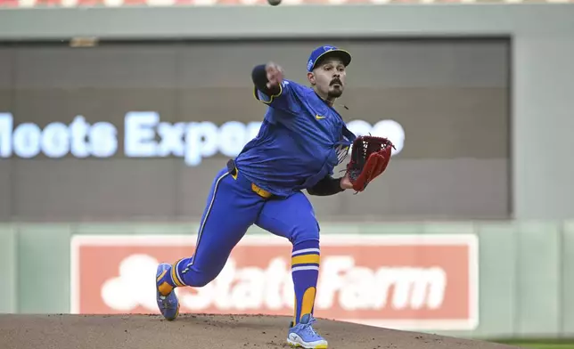 Minnesota Twins starting pitcher Pablo Lopez throws against the Houston Astros during the first inning of a baseball game Friday, July 5, 2024, in Minneapolis. (AP Photo/Craig Lassig)