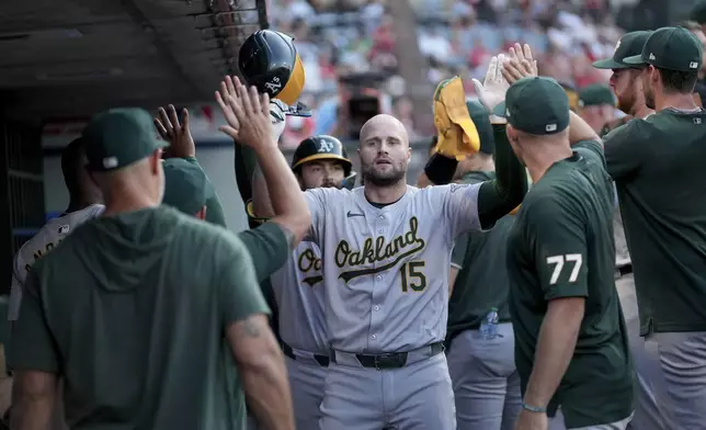 Oakland Athletics' Seth Brown (15) celebrates after hitting a home run during the second inning of a baseball game against the Los Angeles Angels in Anaheim, Calif., Friday, July 26, 2024. (AP Photo/Eric Thayer)