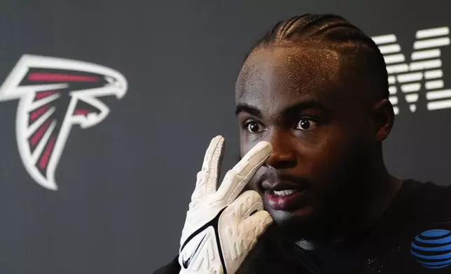 Atlanta Falcons defensive end Grady Jarrett speaks to the media after an NFL training camp football practice Thursday, July 25, 2024, in Flowery Branch, Ga. (AP Photo/John Bazemore)