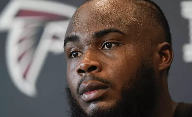 Atlanta Falcons defensive end Grady Jarrett speaks to the media after an NFL training camp football practice Thursday, July 25, 2024, in Flowery Branch, Ga. (AP Photo/John Bazemore)