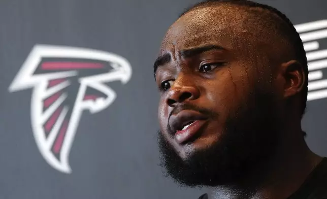 Atlanta Falcons defensive end Grady Jarrett speaks to the media after an NFL training camp football practice Thursday, July 25, 2024, in Flowery Branch, Ga. (AP Photo/John Bazemore)