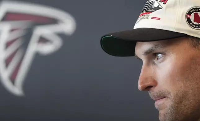 Atlanta Falcons quarterback Kirk Cousins speaks to the media after an NFL training camp football practice Thursday, July 25, 2024, in Flowery Branch, Ga. (AP Photo/John Bazemore)