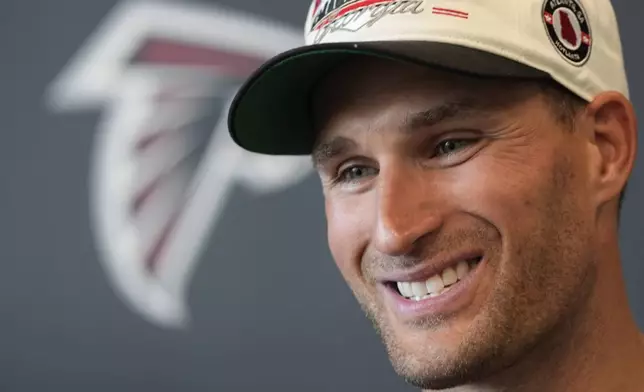 Atlanta Falcons quarterback Kirk Cousins speaks to the media after an NFL training camp football practice Thursday, July 25, 2024, in Flowery Branch, Ga. (AP Photo/John Bazemore)