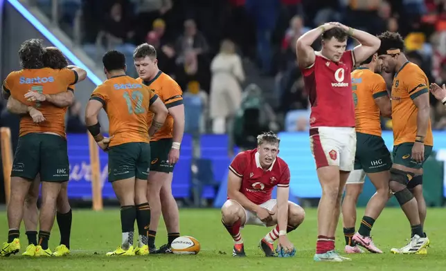 Players react following the first rugby international between Australia and Wales in Sydney, Australia, Saturday, July 6, 2024. Australia defeated Wales 25-16.(AP Photo/Rick Rycroft)