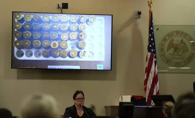 A photo is displayed on a screen during Alec Baldwin's manslaughter trial for the 2021 fatal shooting of cinematographer Halyna Hutchins during filming of the Western movie "Rust", in Santa Fe, N.M., Thursday, July 11, 2024. (Ramsay de Give/Pool Photo via AP)