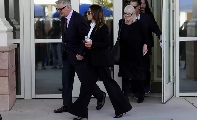 Actor Alec Baldwin, left, exits Santa Fe County District Court, Wednesday, July 10, 2024, in Santa Fe, N.M. with his wife Hilaria Baldwin and sister Elizabeth Keuchler, right. Baldwin is facing a single charge of involuntary manslaughter in the death of a cinematographer. (AP Photo/Ross D. Franklin)