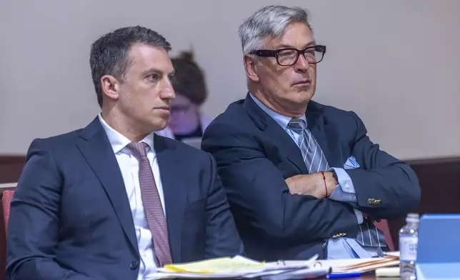 Attorney Alex Spiro, left, sits next to his client, actor Alec Baldwin in District Court in Santa Fe, N.M., during a preliminary hearing on Monday, July 8, 2024. Baldwin faces a single charge of involuntary manslaughter in the death of a cinematographer on the set of the film, "Rust." (Luis Sánchez Saturno/Santa Fe New Mexican via AP)