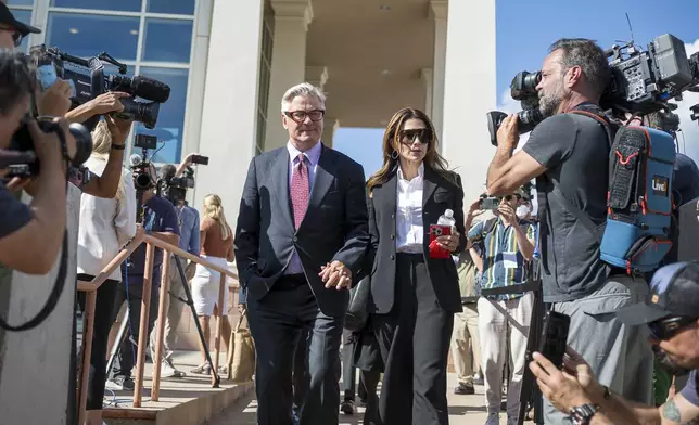 Actor Alec Baldwin and his wife Hilaria Baldwin leave District Court, Wednesday, July 10, 2024, following the day's proceedings in his involuntary manslaughter trial in Santa Fe, N.M. (AP Photo/Roberto E. Rosales)