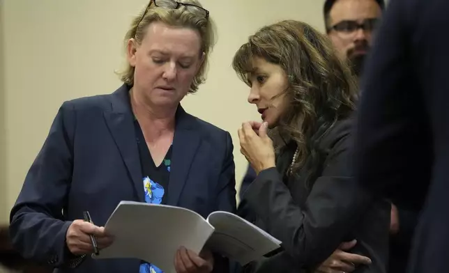 Special prosecutors Kari Morrissey, left, and Erlinda Ocampo Johnson speak during actor Alec Baldwin's hearing in Santa Fe County District Court, Wednesday, July 10, 2024, in Santa Fe, N.M. Baldwin is facing a single charge of involuntary manslaughter in the death of a cinematographer. (AP Photo/Ross D. Franklin, Pool)