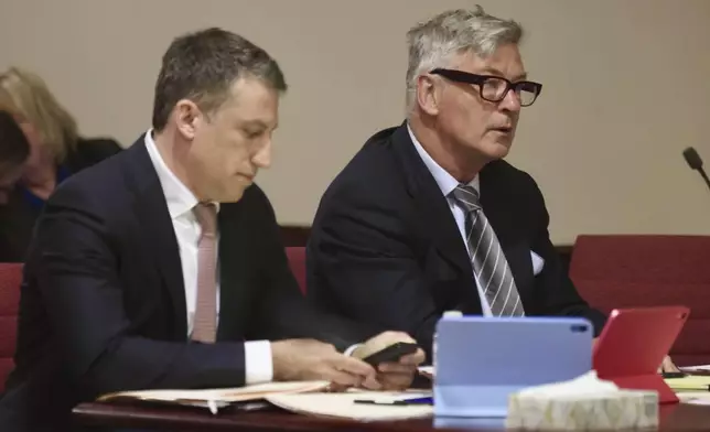 Actor Alec Baldwin, right, and his attorney Alex Spiro appears for a pretrial hearing Monday, July 8, 2024, in Santa Fe, N.M. The actor's involuntary manslaughter trial starts July 9 with jury selection. (Luis Sánchez Saturno/Santa Fe New Mexican via AP)