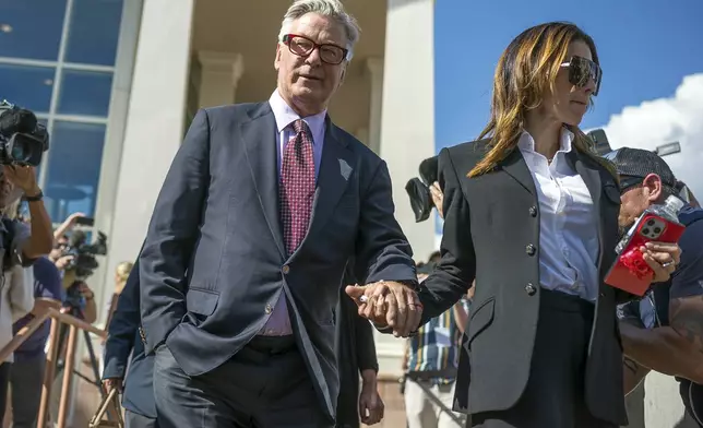 Actor Alec Baldwin and his wife Hilaria Baldwin leave District Court, Wednesday, July 10, 2024, following the day's proceedings in his involuntary manslaughter trial in Santa Fe, N.M. (AP Photo/Roberto E. Rosales)