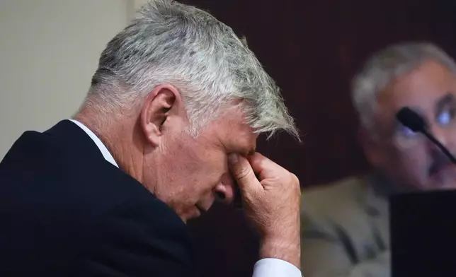 Alec Baldwin wipes his eyes during a preliminary hearing in his involuntary manslaughter trial over a fatal shooting on the set of the film, "Rust," in Santa Fe, N.M., Monday, July 8, 2024. (AP Photo/Ross D. Franklin, Pool)